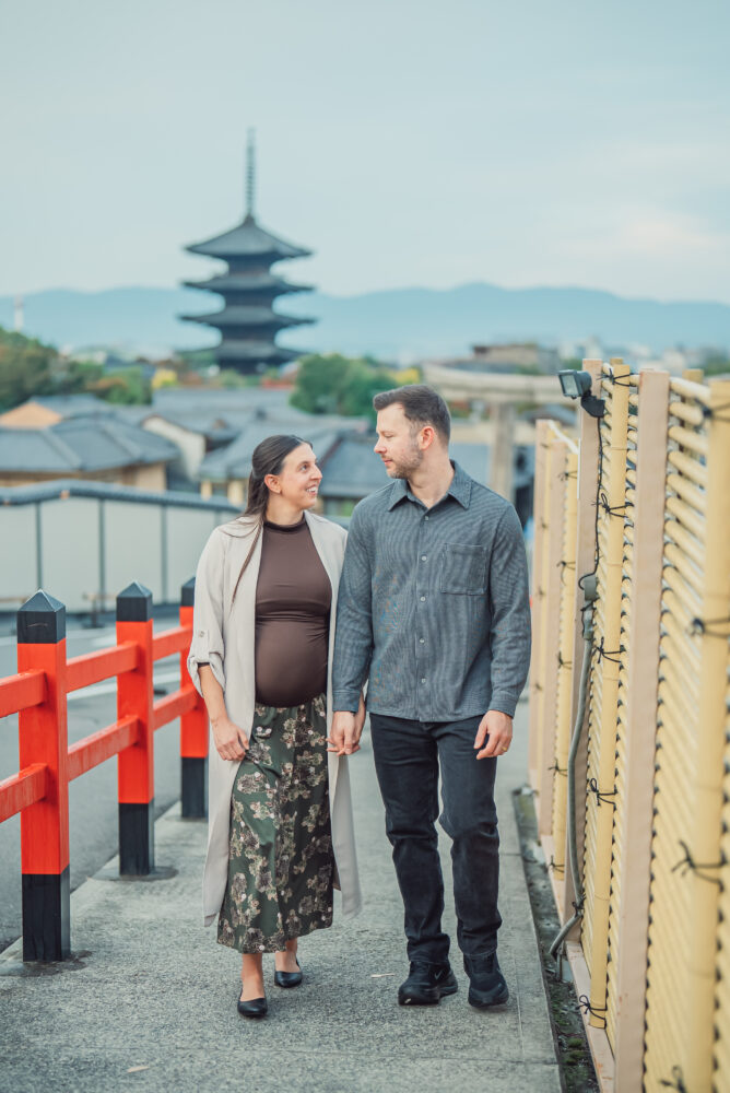 Expecting couple during a maternity photoshoot with Yasaka Pagoda in the background in Higashiyama Kyoto