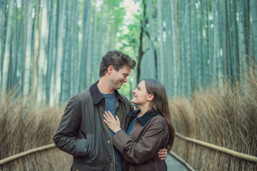 Couple enjoying the peaceful famous Arashiyama Bamboo Forest in Kyoto Japan