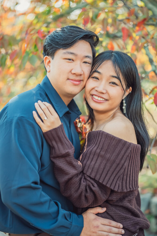 Couple enjoying a quiet moment together on a bench after a Kyoto autumn proposal photoshoot