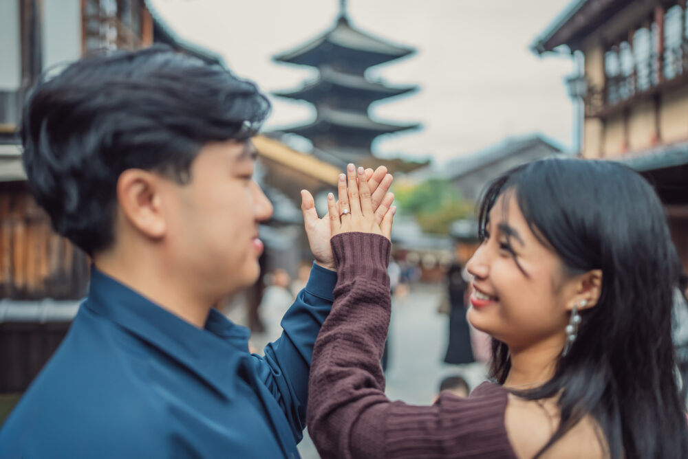 Romantic couple during an autumn proposal photoshoot in Higashiyama Kyoto with Yasaka Pagoda in the background